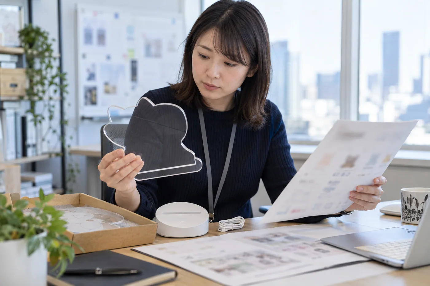 Japanese ecommerce manager reviews a shaped LED board, base and age-use plan